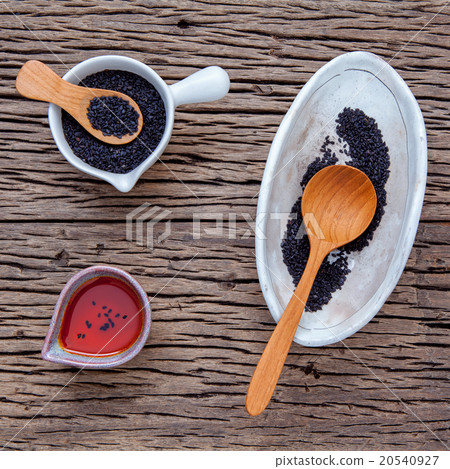 Black sesame oil and sesame seeds . Black sesame oil and sesame seeds . 20540927