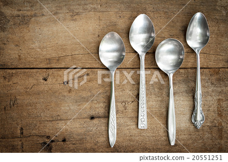 Vintage spoons on wooden background. 20551251