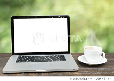 Laptop computer with coffee cup on wooden. 20551258