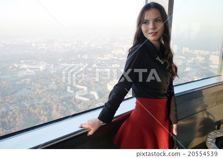 Girl with a telescope on the observation platform tourist 20554539