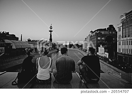 group of young people sitting relaxing in the industrial city group of young people sitting relaxing in the industrial city 20554707
