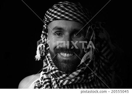 portrait of a bearded man wearing a hijab 20555045