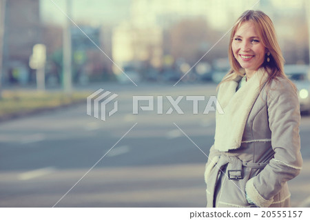 Spring warm blonde portrait in the city Spring warm blonde portrait in the city 20555157