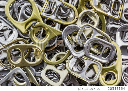 Golden and silver can pull tab. Golden and silver can pull tab. 20555164