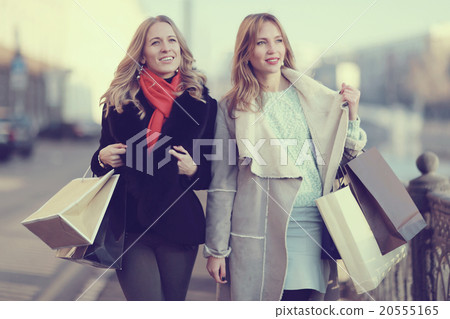 two cheerful blonde for a walk in the city two cheerful blonde for a walk in the city 20555165