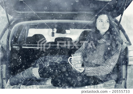 woman with a mug of hot drink in winter forest woman with a mug of hot drink in winter forest 20555733
