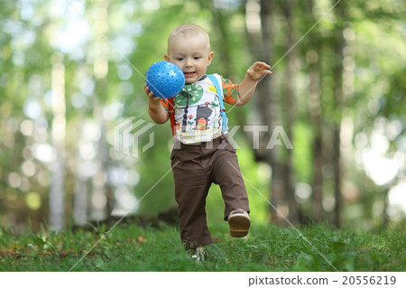child playing with Ball in a summer park 20556219