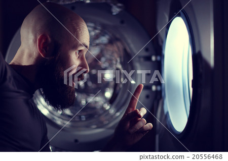 man next to a washing machine man next to a washing machine 20556468