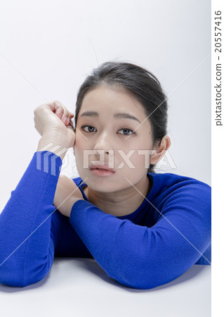 A woman in a sweater A woman in a sweater 20557416