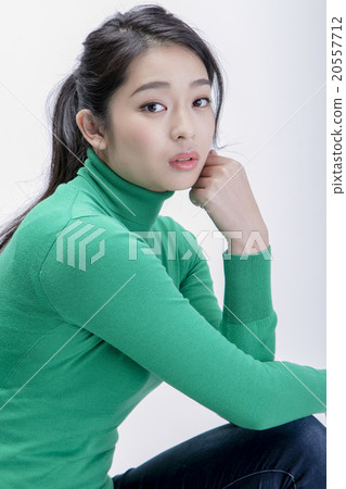 A woman in a sweater A woman in a sweater 20557712