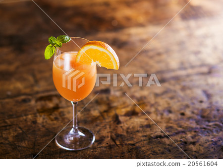 Orange juice in glass with mint and fresh fruit 20561604