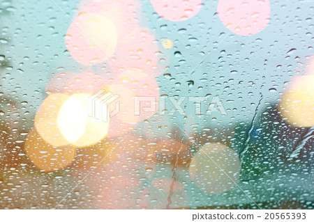 Rain drops on window with light bokeh. 20565393