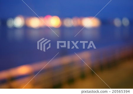 Blurred bokeh of night light at riverside. 20565394