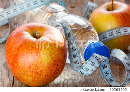 Bottle of water, measuring tape and apples Bottle of water, measuring tape and apples 20565895