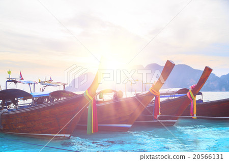 Long boats at tropical beach Long boats at tropical beach 20566131