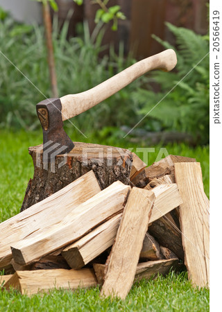 old used ax with a log 20566419