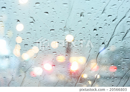 Road view through car window with rain drops. 20566803