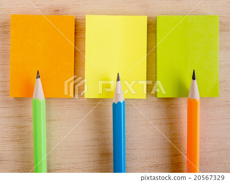 Colorful pencils put on the colorful notepads Colorful pencils put on the colorful notepads 20567329