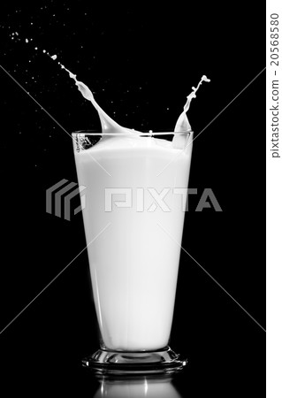 milk splash on black background 20568580