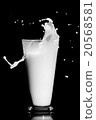 milk splash on black background 20568581