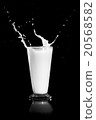 milk splash on black background 20568582