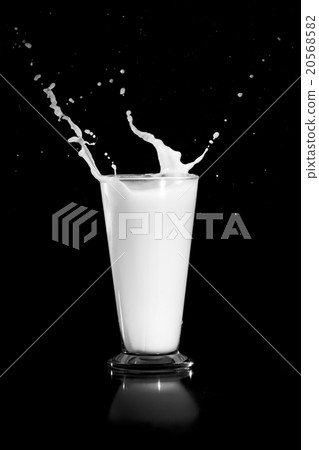 milk splash on black background milk splash on black background 20568582