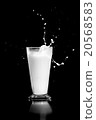 milk splash on black background 20568583