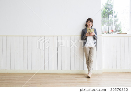 Young woman reading a book Young woman reading a book 20570830