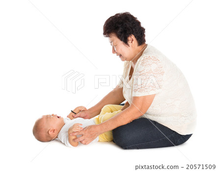 Grandmother comforting crying grandson. 20571509