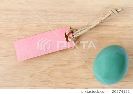 Blank paper tag and easter egg on wood background. Blank paper tag and easter egg on wood background. 20574131