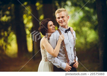 Beautiful wedding couple posing 20575860