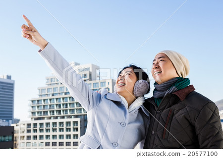 Happy woman pointing finger with boyfriend Happy woman pointing finger with boyfriend 20577100