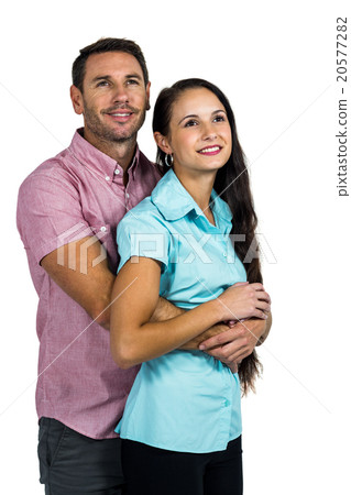 Thoughtful smiling couple hugging Thoughtful smiling couple hugging 20577282