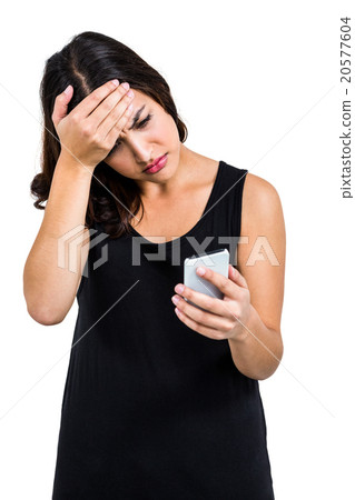 Depressed woman holding phone 20577604