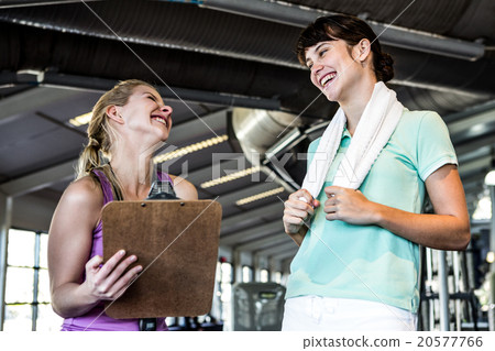 Two women smiling at each other 20577766