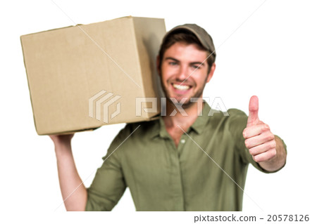 Handsome postman holding pack showing thumbs up 20578126