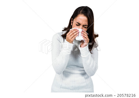 Woman sneezing while standing Woman sneezing while standing 20578216