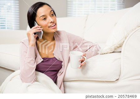 Smiling brunette on a phone call 20578469