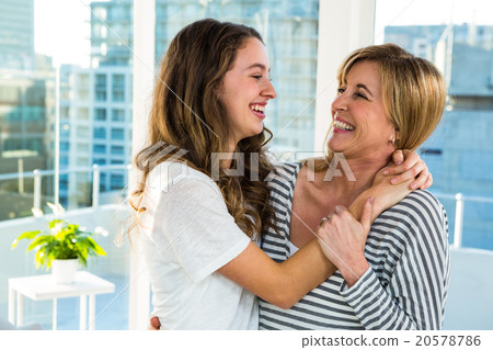 Mother and daughter smiling 20578786