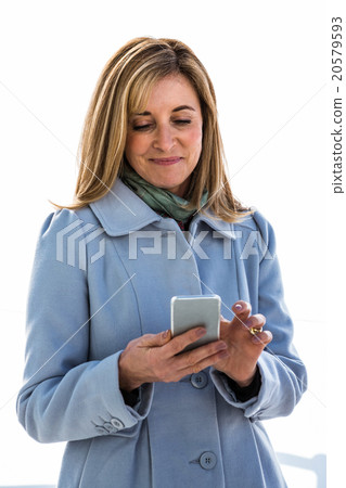 woman looking at her phone 20579593