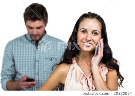 Happy couple using smartphones 20580034