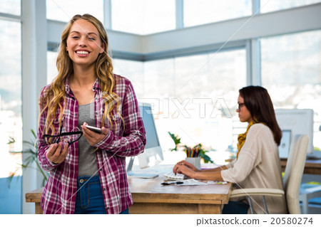 Two girls work at office Two girls work at office 20580274