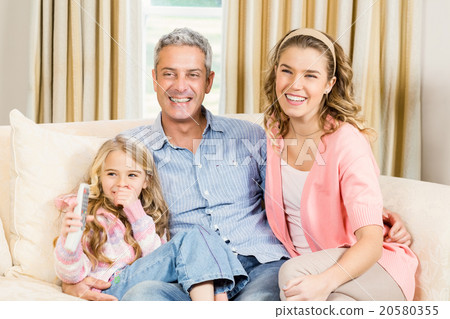 Happy family sitting together Happy family sitting together 20580355