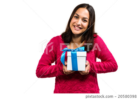 Portrait of beautiful young woman holding gift box Portrait of beautiful young woman holding gift box 20580398
