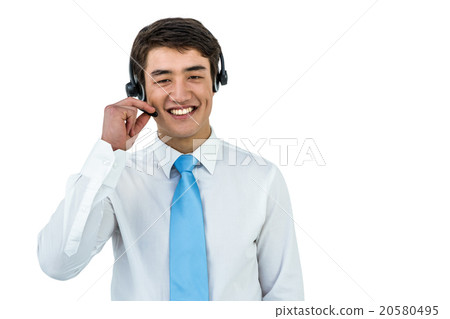 Smiling asian businessman using headset 20580495