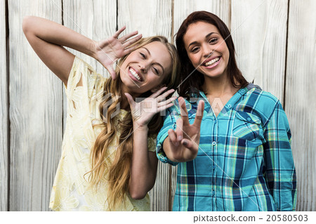 Two friends smiling at camera Two friends smiling at camera 20580503