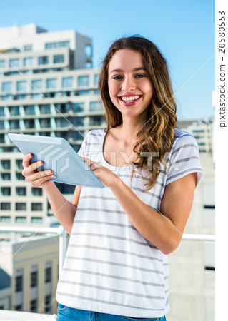 Young girl using her tablet 20580553