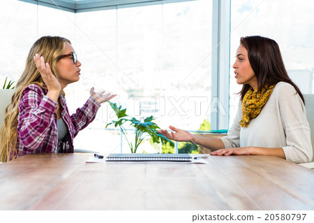 Two girls work at office Two girls work at office 20580797