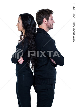 Couple standing back to back after argument 20581940