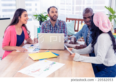 Business people discussing at desk Business people discussing at desk 20582053